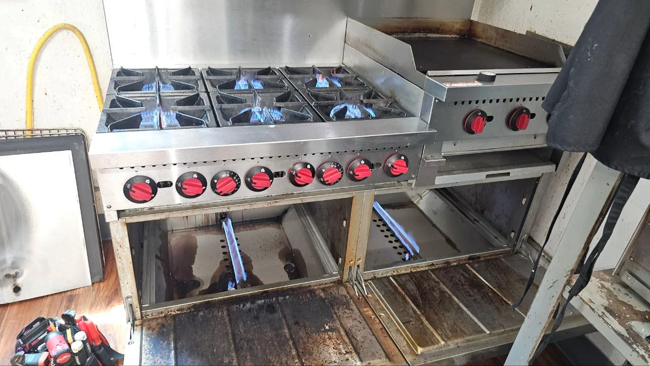 Range burners opened for component service