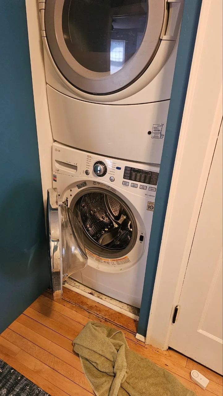 Stacked washer and dryer in a compact laundry space