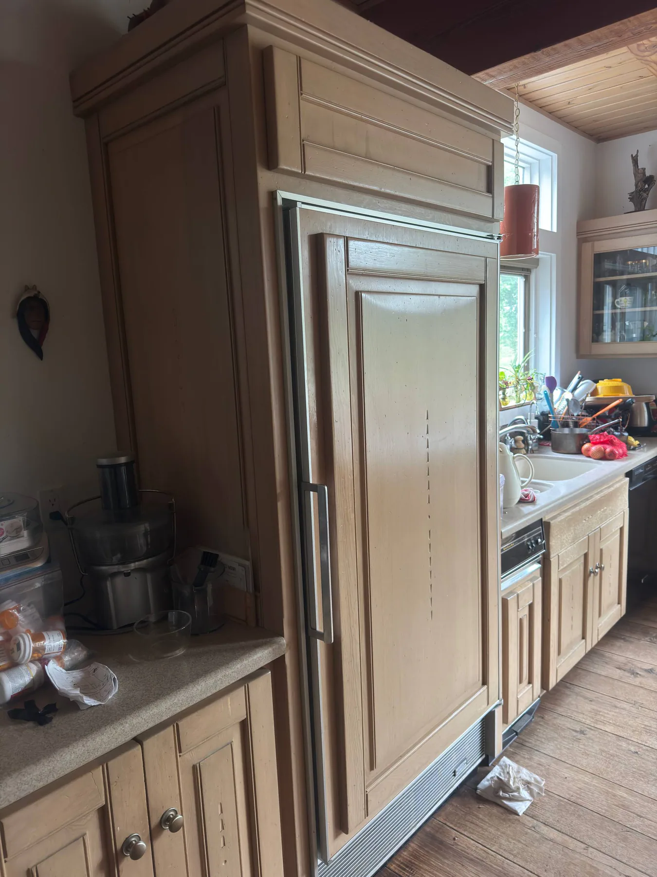 Panel-ready built-in refrigerator during service